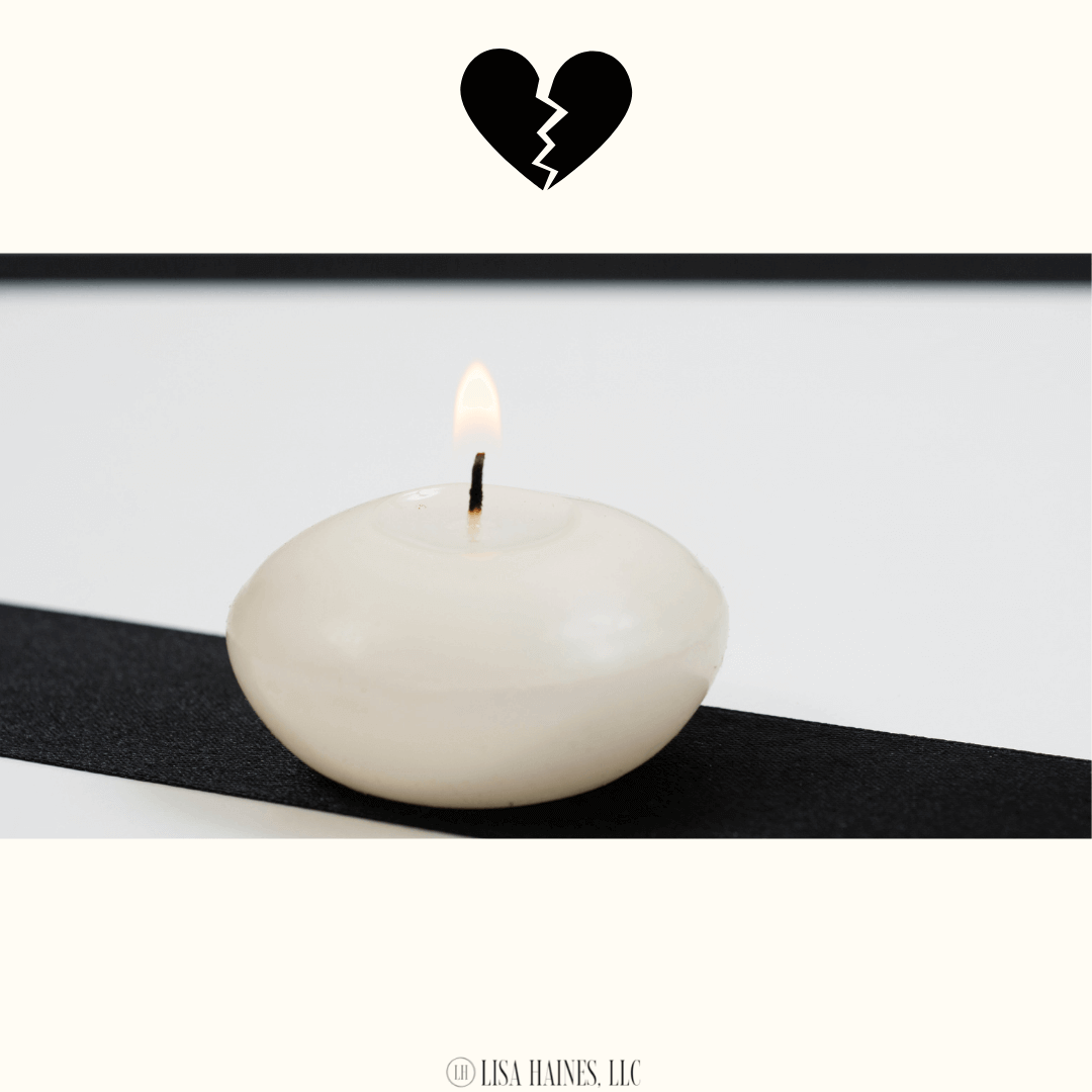 A broken heart & lit candle